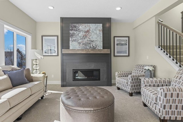 2080 151st Ave NW, Andover, MN 55304 - carpeted living room with a fireplace, baseboards, stairway, and recessed lighting