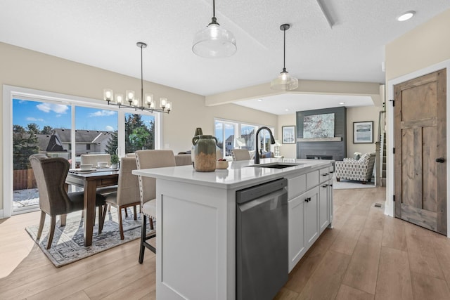 2080 151st Ave NW, Andover, MN 55304 - kitchen with a sink, dishwasher, light wood-style flooring, open floor plan, and a chandelier