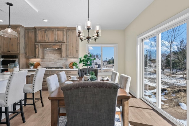 2080 151st Ave NW, Andover, MN 55304 - dining area featuring a chandelier, healthy amount of natural light, light wood-style flooring, and recessed lighting