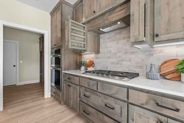 2080 151st Ave NW, Andover, MN 55304 - kitchen with stainless steel appliances, tasteful backsplash, and light countertops