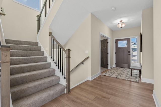 2080 151st Ave NW, Andover, MN 55304 - entryway featuring wood finished floors, baseboards, and stairs
