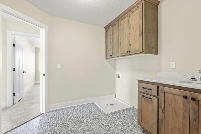 2080 151st Ave NW, Andover, MN 55304 - laundry room with hookup for a washing machine, cabinet space, baseboards, and a textured ceiling