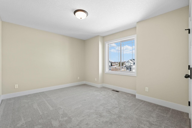 2080 151st Ave NW, Andover, MN 55304 - spare room with carpet floors, baseboards, and a textured ceiling