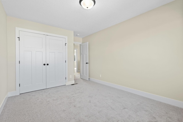 2080 151st Ave NW, Andover, MN 55304 - unfurnished bedroom featuring baseboards, carpet, and a closet