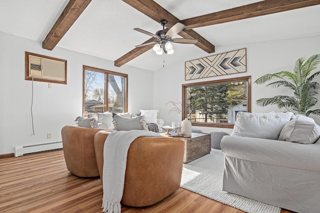 living area featuring ceiling fan, wood finished floors, a wall unit AC, and a baseboard radiator