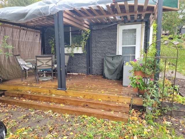 wooden deck with outdoor dining space