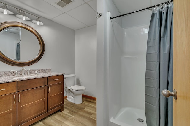 344 Riverside Ave S, Sartell, MN 56377 - bathroom with wood finished floors, vanity, a shower with curtain, toilet, and baseboards