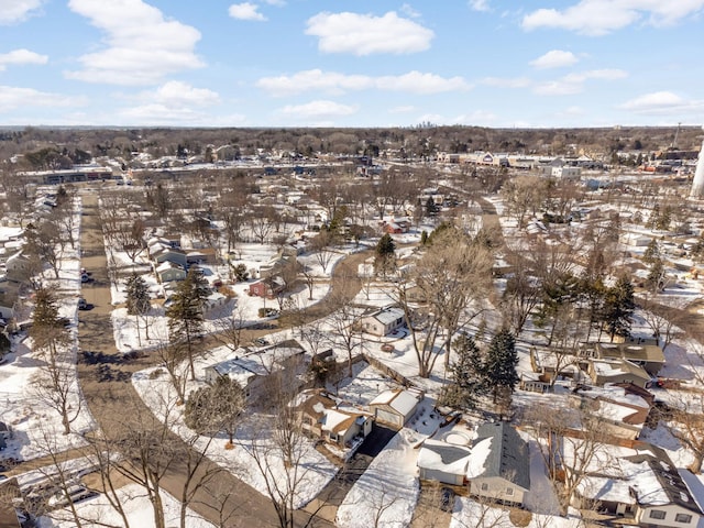 snowy aerial view with a residential view