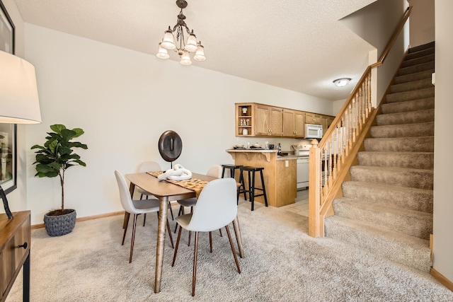 dining area featuring a chandelier, a textured ceiling, light colored carpet, baseboards, and stairway