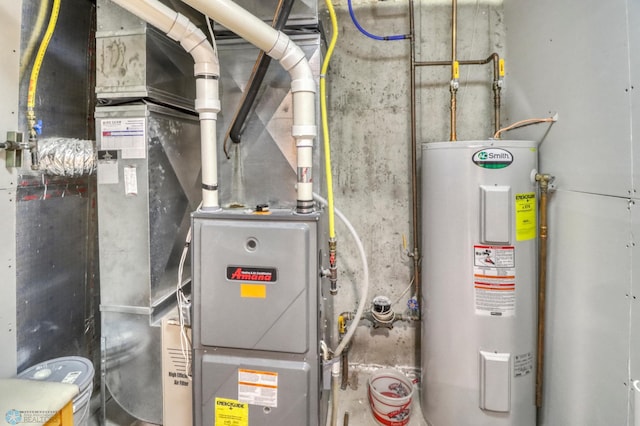 utility room featuring water heater