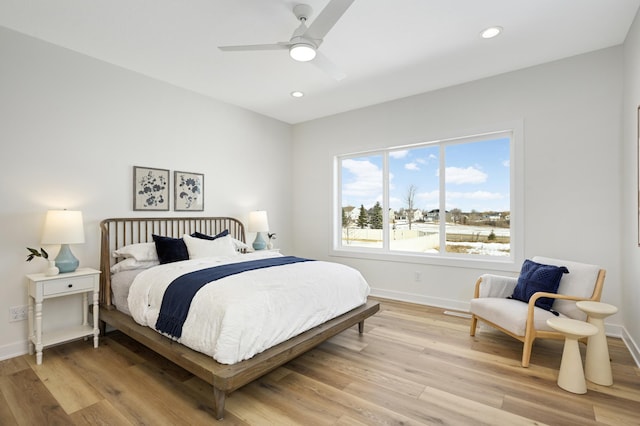 bedroom with recessed lighting, a ceiling fan, light wood-type flooring, and baseboards