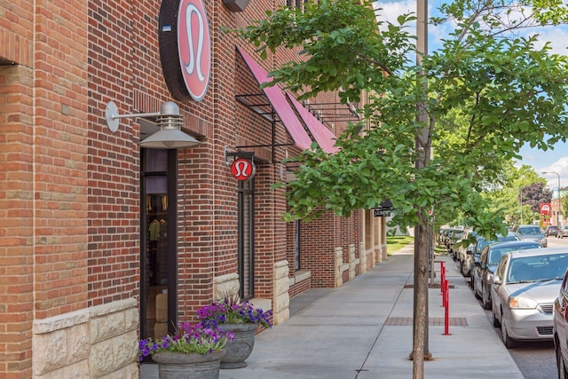 exterior space with brick siding