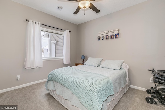 bedroom featuring carpet, baseboards, and a ceiling fan