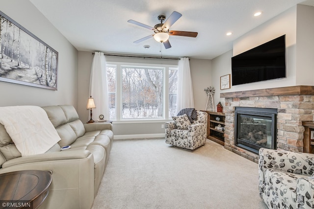 carpeted living area featuring a fireplace, baseboards, a ceiling fan, and recessed lighting