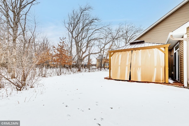 view of yard covered in snow