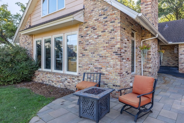 view of patio / terrace featuring an outdoor fire pit