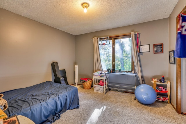 carpeted bedroom featuring a textured ceiling