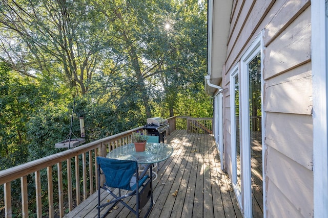 wooden deck with area for grilling