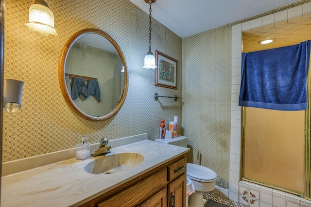 71 Deer Hills Ct, North Oaks, MN 55127 - full bath with toilet, vanity, a walk in shower, wallpapered walls, and a textured ceiling