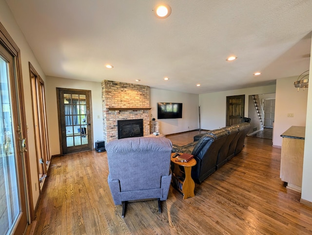 71 Deer Hills Ct, North Oaks, MN 55127 - living room with wood finished floors, a brick fireplace, stairs, recessed lighting, and baseboards
