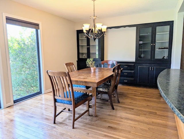 71 Deer Hills Ct, North Oaks, MN 55127 - dining room featuring a chandelier and light wood finished floors