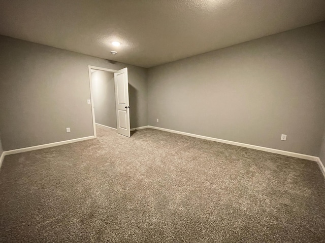 interior space with carpet flooring and baseboards