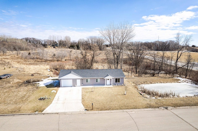 view of front of home featuring a garage and concrete driveway