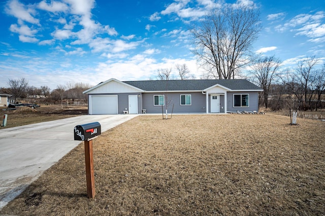 ranch-style house with driveway and a garage