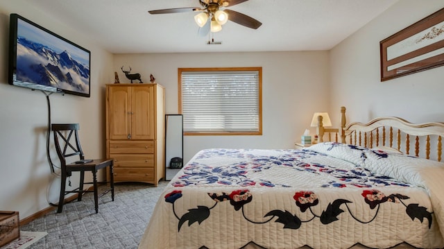 bedroom featuring light carpet, a ceiling fan, visible vents, and baseboards