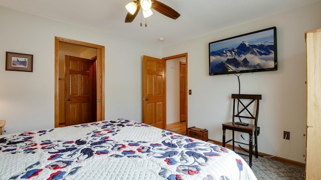 bedroom featuring baseboards and a ceiling fan