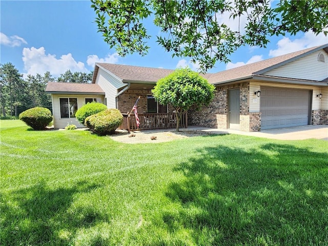 E5751 816th Ave, Tainter Twp, WI 54730 - ranch-style home with brick siding, a front yard, a garage, driveway, and a shingled roof