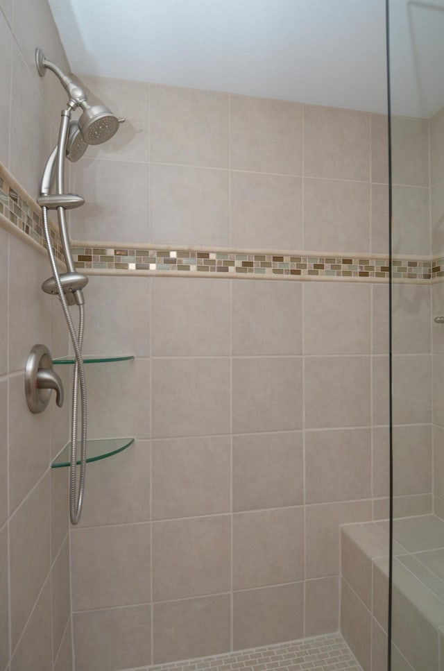 bathroom with a tile shower