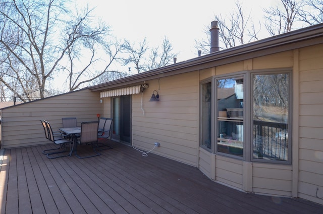 wooden terrace featuring outdoor dining area