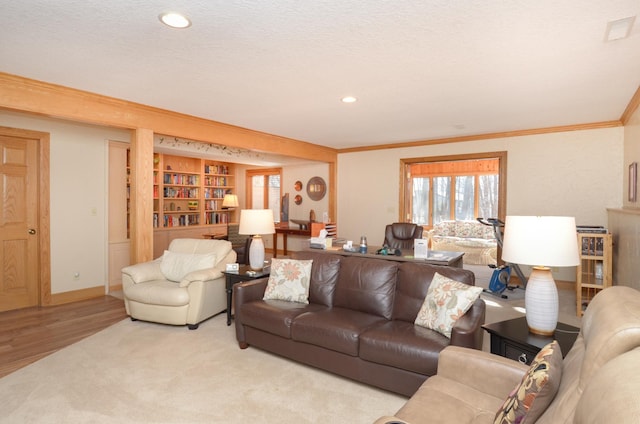 living room featuring baseboards, ornamental molding, recessed lighting, wood finished floors, and a textured ceiling