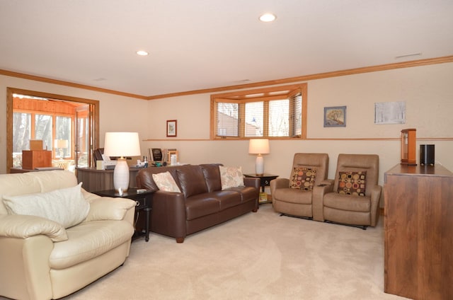 living area featuring recessed lighting, light carpet, and ornamental molding