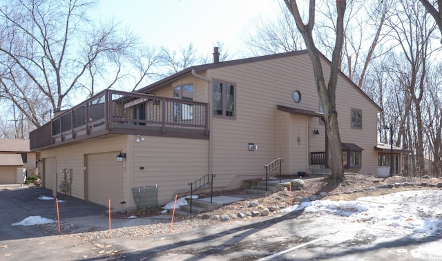 view of property exterior featuring an attached garage