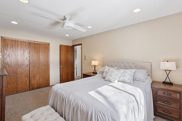 bedroom with recessed lighting, a closet, carpet floors, and a ceiling fan