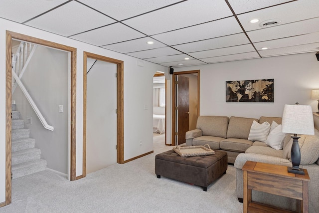 living room with visible vents, stairs, carpet floors, recessed lighting, and arched walkways