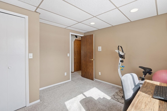 carpeted office featuring a drop ceiling, recessed lighting, and baseboards