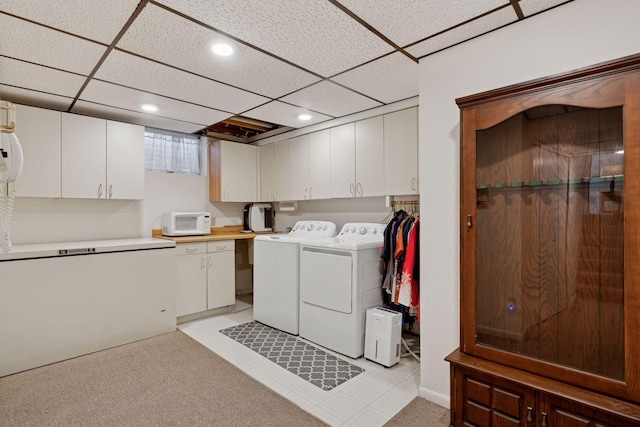 laundry room featuring cabinet space, recessed lighting, and washer and dryer