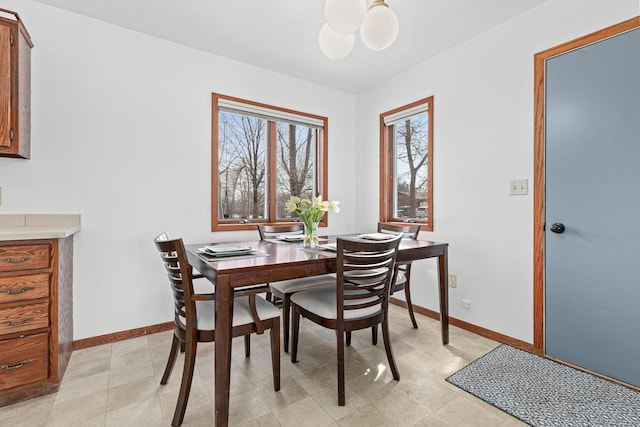 dining room featuring baseboards