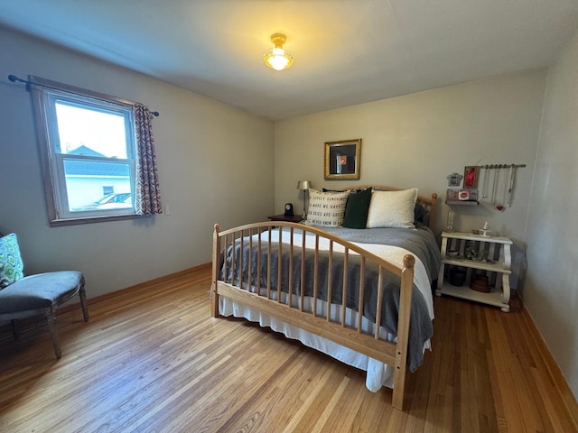 bedroom with wood finished floors