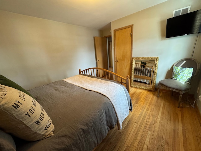 bedroom with light wood finished floors