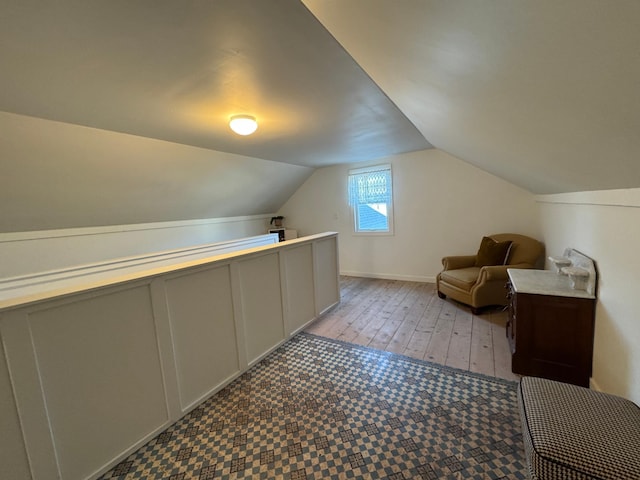 additional living space featuring vaulted ceiling