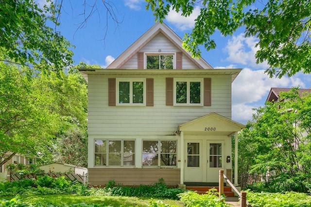 rear view of house with entry steps