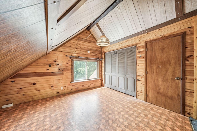 additional living space with tile patterned floors, wooden walls, and vaulted ceiling