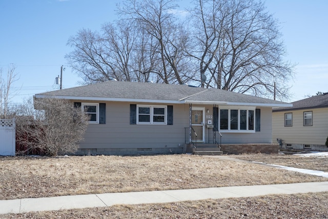 ranch-style home with roof with shingles and crawl space