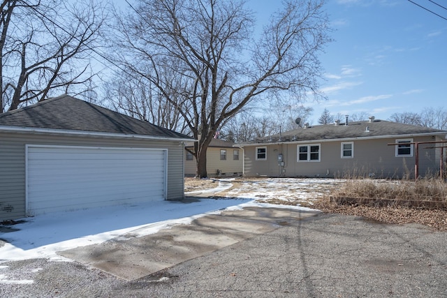 single story home featuring an outbuilding