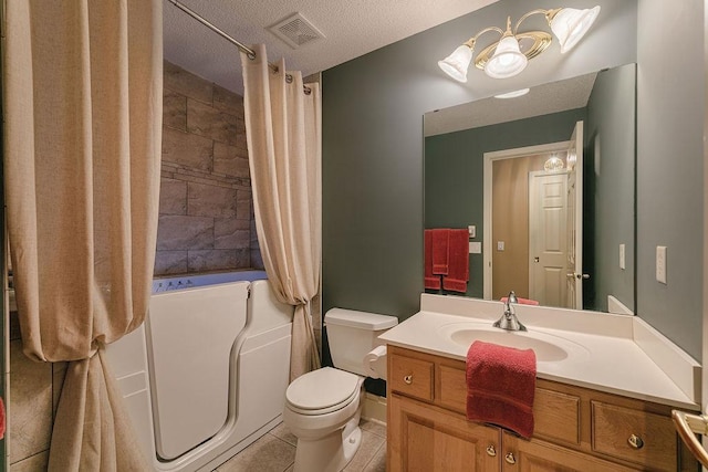 bathroom featuring tile patterned floors, visible vents, toilet, a textured ceiling, and vanity