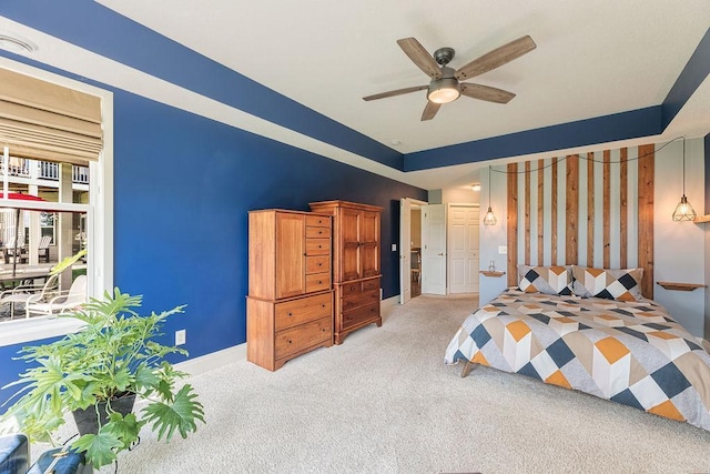 bedroom with a ceiling fan, light colored carpet, and baseboards